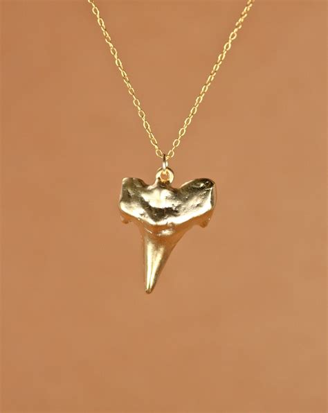 14k gold shark tooth pendant.